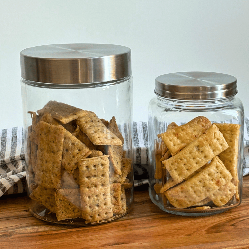 Sourdough discard crackers in glass jars.