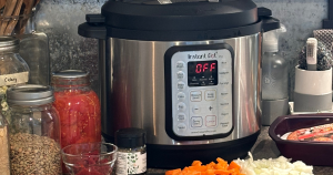 Instant Pot and soup ingredients on counter.