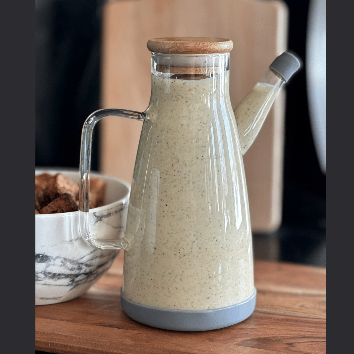 Container full of salad dressing.