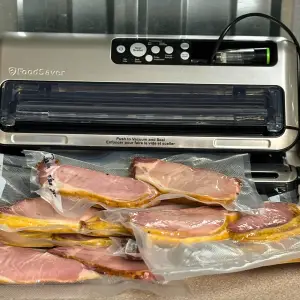 Individual vacuumed sealed packages of Homemade Canadian Bacon.