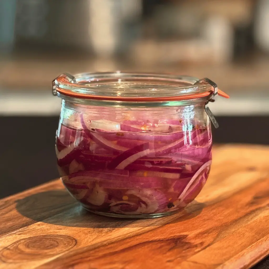 Wreck jar of pickled red onions.