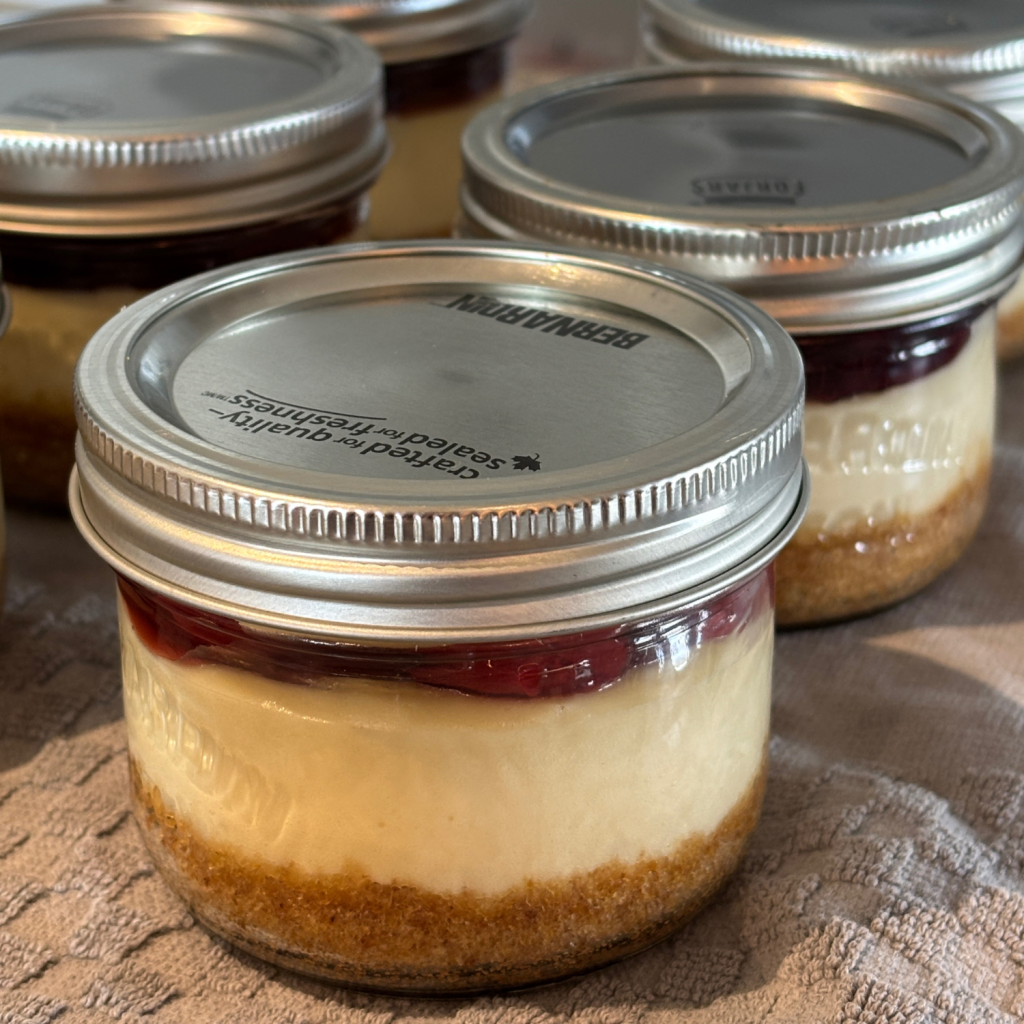 Cheesecake in a jar with lids and rings.