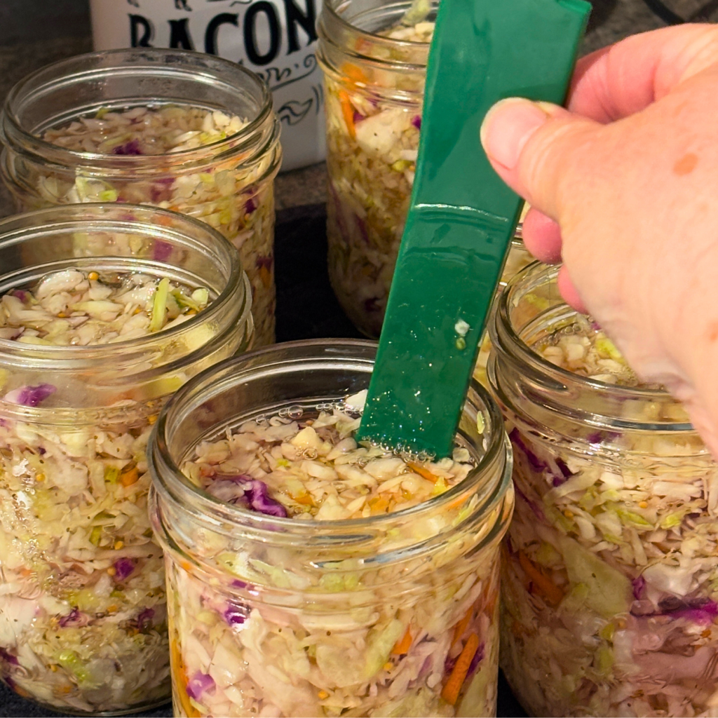 De-bubbling tool in a jar of this canned coleslaw recipe.