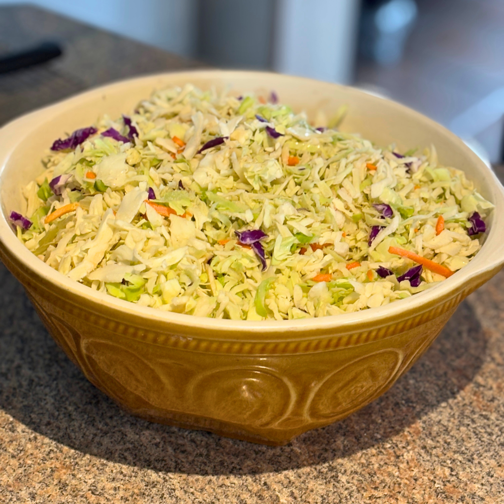 Bowl of shredded cabbage mixture.