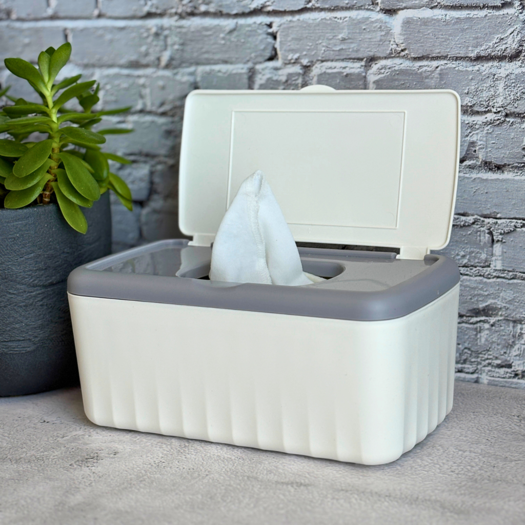 Container with flannel sheets used as homemade dryer sheets.