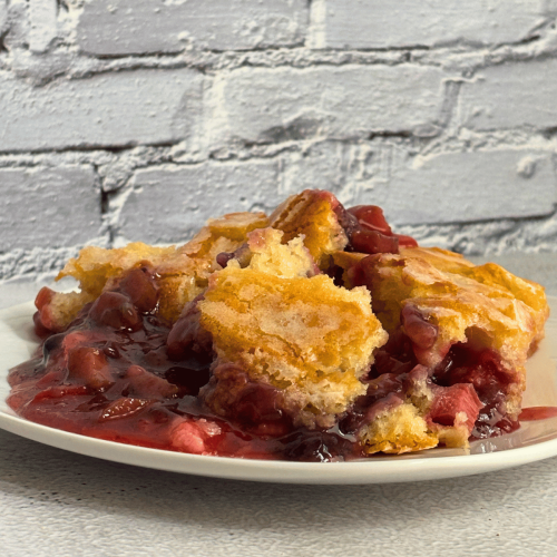 plate with strawberry-rhubarb pudding cake