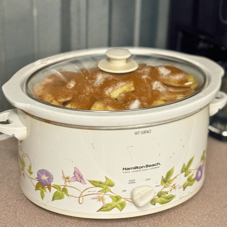 Apple slices with cinnamon and sugar in a crockpot