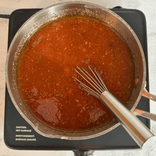 A pot of homemade pizza sauce.