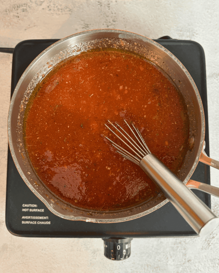 A pot of homemade pizza sauce.