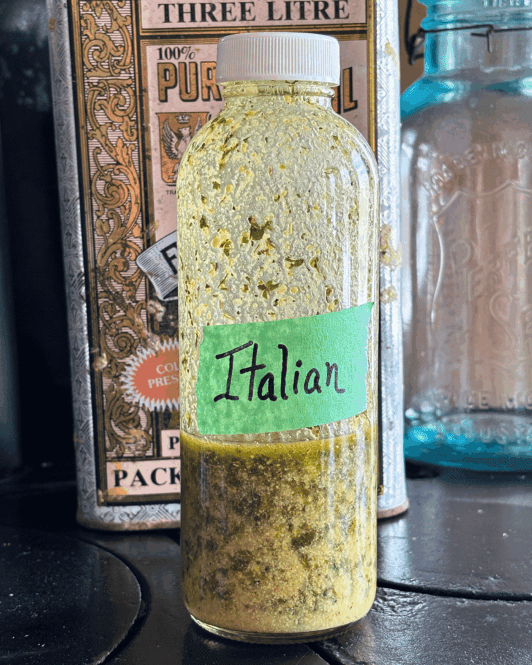 Glass bottle with golden Italian Salad dressing