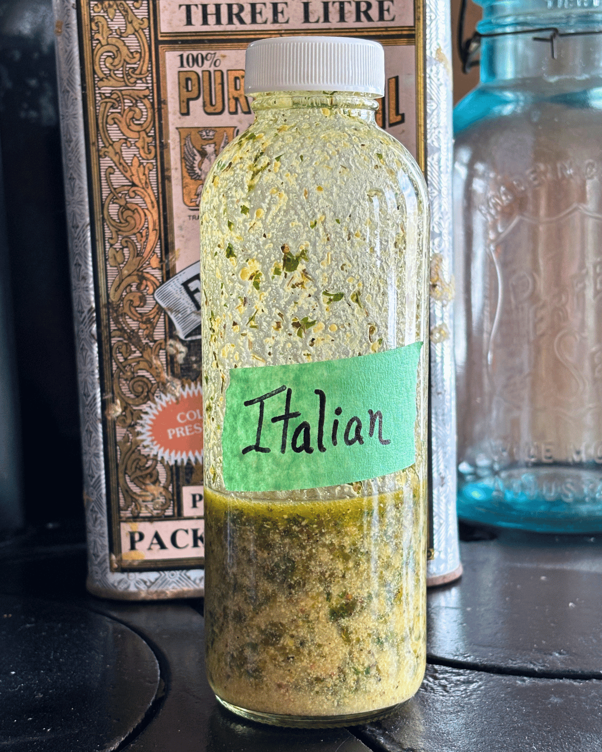 Glass bottle with golden Italian Salad dressing